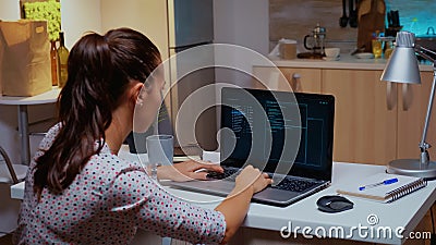 Back view of woman hacker coding a dangerous virus Stock Photo