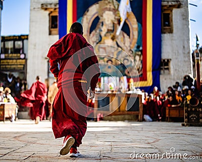 Back view of young Tibetan Buddhist Monks at the ancient Tiji Festival in walled city of Lo Manthang Editorial Stock Photo