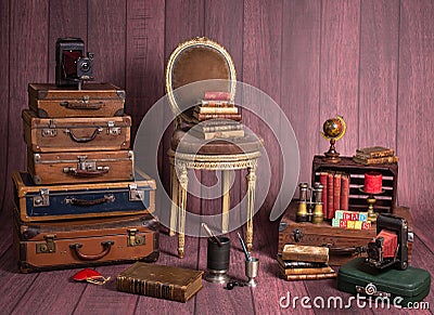 Backdrop with vintage decor and accesories like suitcases, books, typewriter, chair Stock Photo