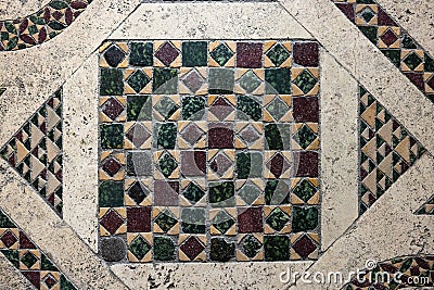 antique close up of earth muted tones geometrically patterned mosaic floor background Stock Photo