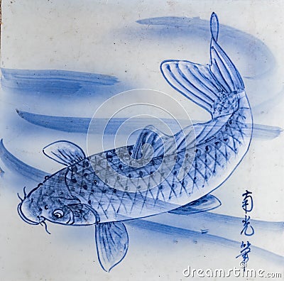 close up of square traditional Tobeyaki cream ceramic tile with a indigo blue carp in the water design background Stock Photo