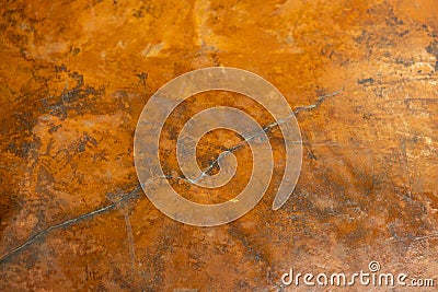 multi toned close up of semi smooth weathered golden orange stucco wall texture background Stock Photo