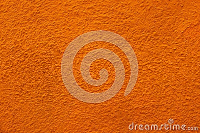 close up of bright grunge Orange Roughy stucco wall texture background Stock Photo