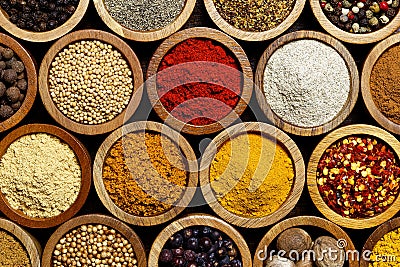 Background of arranged spices in small wood bowls. Stock Photo
