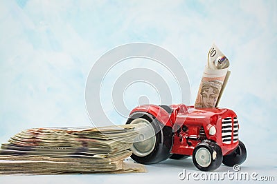 toy car with pile of money UK pounds banknotes Editorial Stock Photo