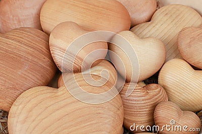 Background of big and small heart-shaped things made of wood. Horizontal Stock Photo