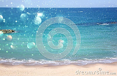 Background of blurred beach and sea waves with bokeh lights Stock Photo