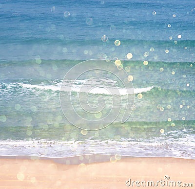 Background of blurred beach and sea waves with bokeh lights, vintage filter. Stock Photo