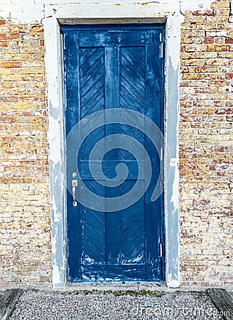 Background of Brick and Stone Wall with Classic Blue Door Stock Photo