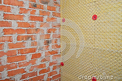 Background of brick wall and a wall of insulation Stock Photo