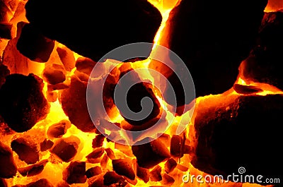Background of burning and flaring pieces of coal anthracite of different fractions. Stock Photo