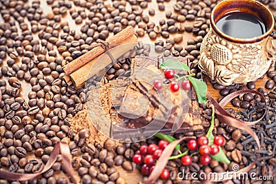 Background of chocolate bar, cup of coffee, hazelnuts, for holiday Stock Photo