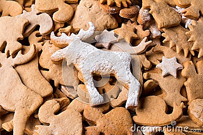 Background with Christmas cookies gingerbread. Gingerbread in the shape of animals, stars and hearts. Stock Photo