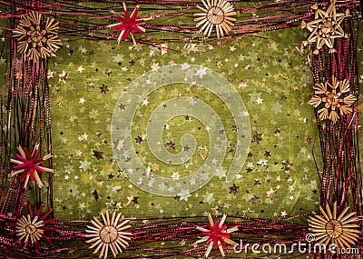 Background for Christmas greeting card- holiday straw decoration, green color textured fabric Stock Photo