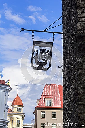 Background cityscape sign with angry muse in Tallinn Stock Photo