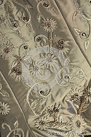Background close up of vintage wedding dress fabric and beading Stock Photo