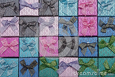 Background of colored square gift boxes with bows Stock Photo