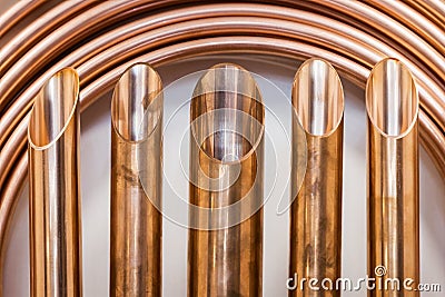 Background of copper pipes for plumbing and climate engineering Stock Photo