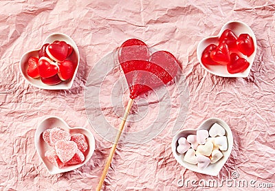 Background of crumpled pink paper with candy Stock Photo