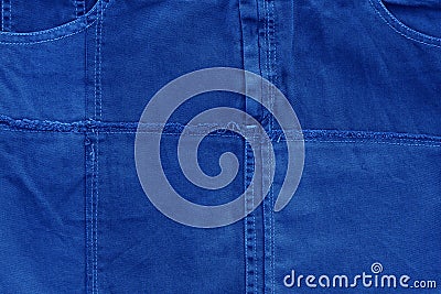 Background of fabric jeans made of Classic Blue 2020 color. Color of year 2020 tissue backdrop for holidays and parties. COY2020 Stock Photo