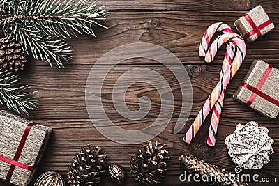 Background. Fir tree, decorative cone. Message space for Christmas and New Year. Sweets and gifts for holidays. colored candies. Stock Photo