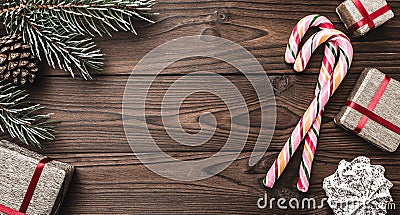 Background. Fir tree, decorative cone. Message space for Christmas and New Year. Sweets and gifts for holidays. colored candies. Stock Photo