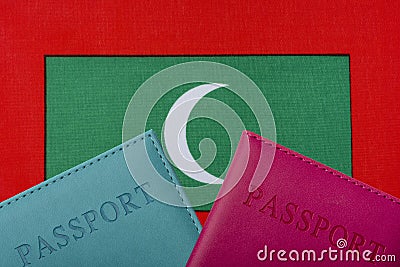On the background of the flag of Maldives two passports Stock Photo