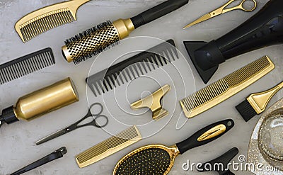 Background with gold and black hair salon accessories. Stock Photo