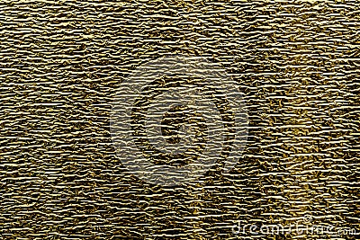 Background of goldy shiny foil with fine horizontal stamping Stock Photo