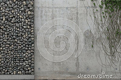 Background with gray concrete wall and gabion wall with stones in a metal grid frame. Front view with copy space. 3D rendering. Stock Photo