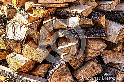 Background of heap firewood stack from natural wood Stock Photo