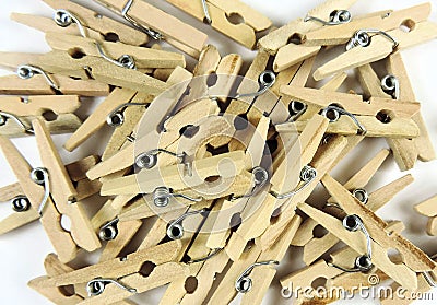 background of heap of wooden clothespins, selective focus . Stock Photo