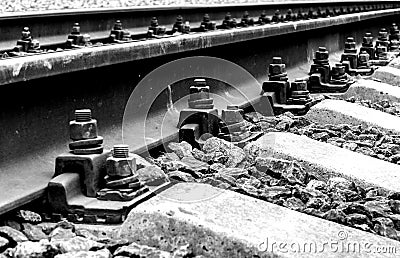 The background image is a close-up of rails and concrete sleepers Stock Photo