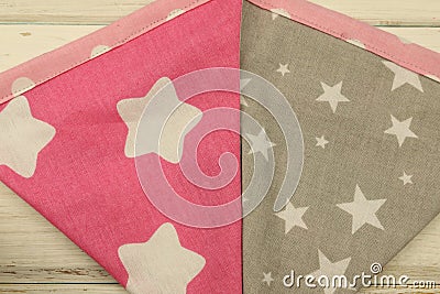 Background image, colored fabric flaps on a white wooden background. Stock Photo