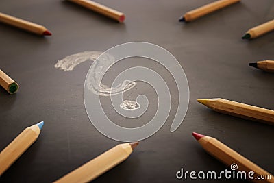 Background image of pencils over chalkboard and chalkboard Stock Photo