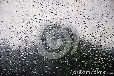 Background image of rain drops on a glass window. Macro photo with shallow depth of fiel Stock Photo