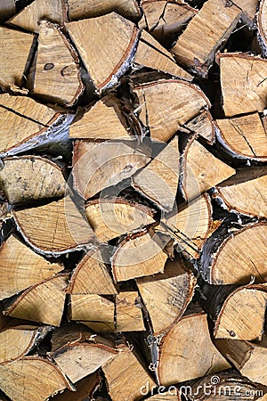 Background image of woodpile. Firewood is neatly stacked. Birch logs Stock Photo