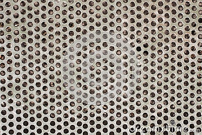 Background for an industrial theme. The surface texture of the metal grill with round holes Stock Photo