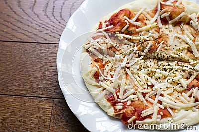 Background of Instant pizza cheese and ketchup over origano on w Stock Photo