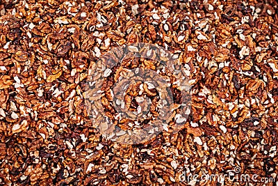 Background from a kernels of walnuts. Close-up texture of heap of unshelled walnuts, overhead view Stock Photo