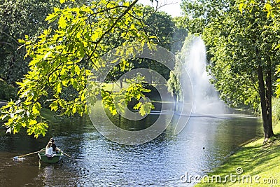 Background landscape of two girls ride in a boat l in Riga Editorial Stock Photo
