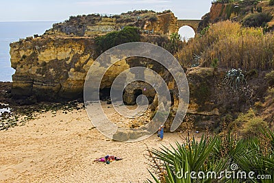 Background landscape view of an arched bridge between rocks on one of the beaches of Lagos Editorial Stock Photo