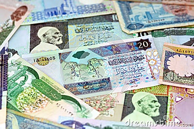 Background of Libyan money dinars banknotes with portraits of Omar Al-Mukhtar on some banknotes Stock Photo