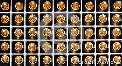 Background is made of bullet cartridges standing in an up-tipped box Stock Photo