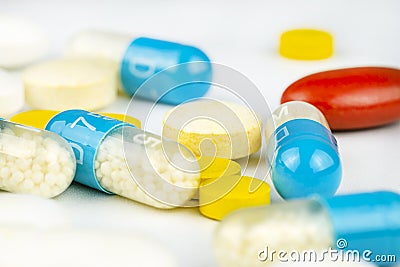 Background made of different kinds of colorful pills and tablets, macro shot. Stock Photo
