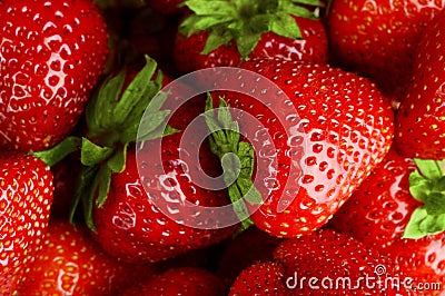 Background made from many red juicy fresh strawberries Stock Photo