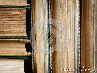 Background made of old books arranged in stacks Stock Photo
