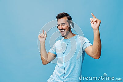 Background man lifestyle music fun blue sing studio copy t-shirt happy space headphone portrait online Stock Photo