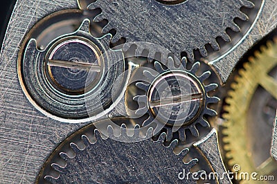 Background with metal cogwheels a clockwork. Macro, extreme closeup. Stock Photo