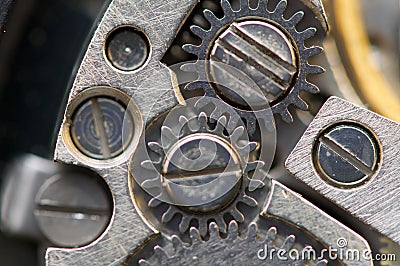Background with metal cogwheels a clockwork. Macro, extreme closeup. Stock Photo